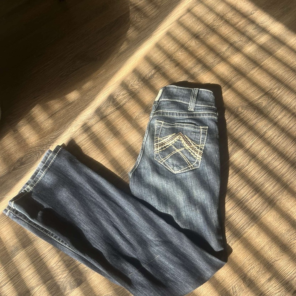 Dark blue low rise Ariat jeans